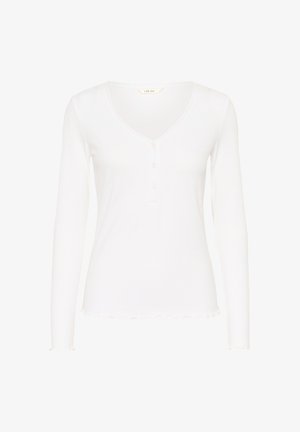 Top blanco de manga larga con textura acanalada, escote en v y cuatro botones en el frente. Bordes festoneados en los puños y el dobladillo. Tela suave y ligera.