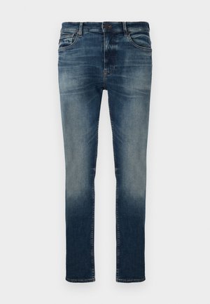 Donkerblauwe denim jeans met een vervaagde was, slim fit, vijfzakken ontwerp, riemlussen en metalen knoopsluiting. Zachte textuur.