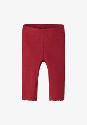Leggings rouges côtelés avec une texture douce, un ourlet festonné et des accents de paillettes subtiles pour plus de détails.