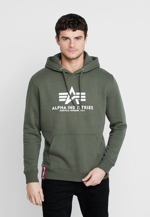 Green cotton hoodie with white Alpha Industries logo and stars. Features a kangaroo pocket and ribbed cuffs at the sleeves and waist.