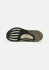 Schuhsohle mit einem schwarzen und olivgrünen Farbschema, strukturiertem Gummi und einem Muster aus Rillen und Erhöhungen für besseren Grip.