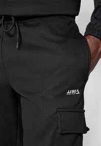 Jack & Jones Performance JPSTGORDON JJBASIC ICE CARGO PANTS - Hlače - black