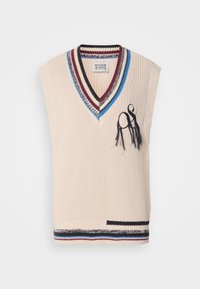 Veste sans manches en tricot beige avec encolure en V, bordure à rayures multicolores, et motif abstrait brodé en noir sur le côté gauche avant.