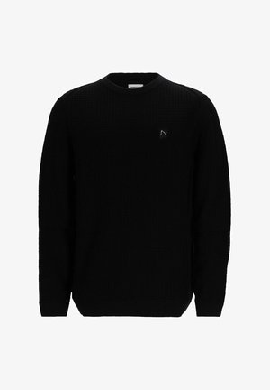 Suéter negro texturizado con cuello redondo, mangas largas y un pequeño parche de logo en el pecho. Patrón de punto en toda la tela.