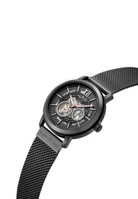 Reloj de acero inoxidable negro con correa de malla. Presenta un detallado dial negro, movimiento mecánico visible y acentos plateados.
