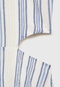 Striped fabric in shades of blue and white with gold metallic accents, featuring a textured woven pattern and a cut-out design.