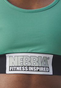 Nebbia WOMENS - Športni modrček s srednjo podporo - green