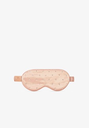 Masque de sommeil en soie rose pâle, présentant une texture lisse avec des embellissements en cristal ronds uniformément répartis sur la surface. Sangle élastique incluse.