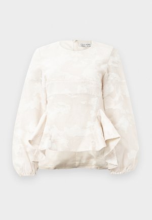 Lys beige bluse med tekstureret blomsterprint, rund halsudskæring, lange pufærmer og peplum-stil ved taljen. Lynlåslukning bagpå.