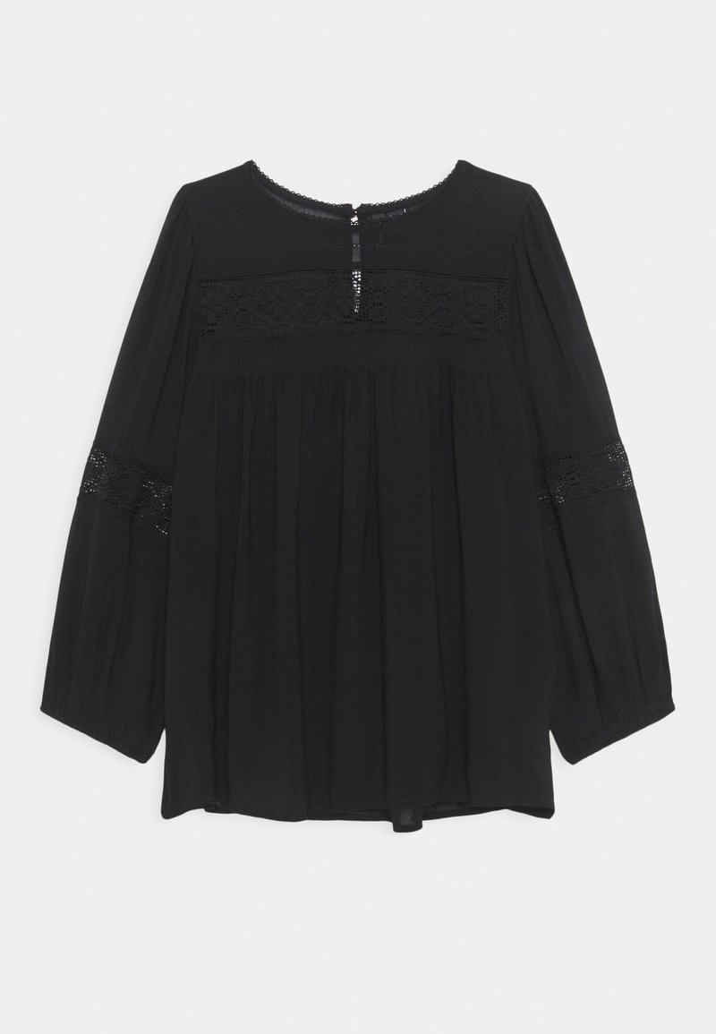 Blouse noire à manches longues, dotée d'accents en dentelle, d'un col rond et d'une fermeture en goutte d'eau au dos. Fabriquée en tissu léger et texturé.