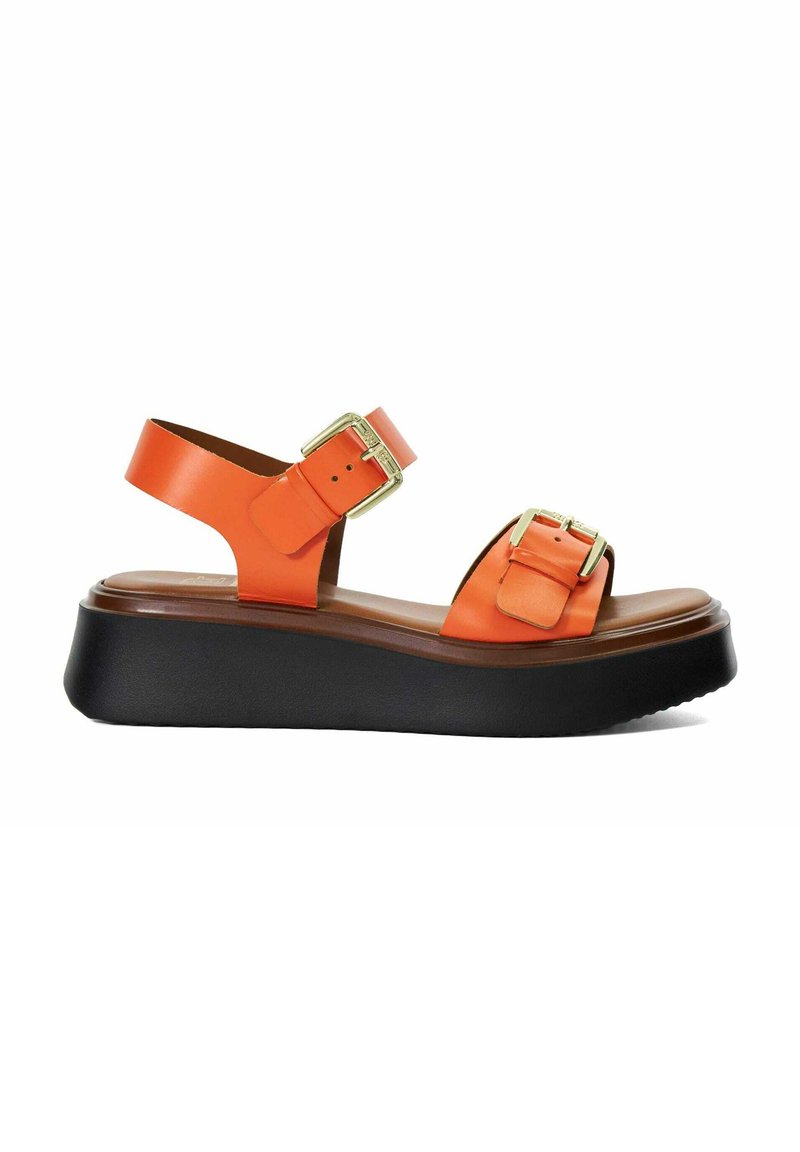 Orange leather platform sandal with two gold-tone buckles and black thick sole, side profile on white background.