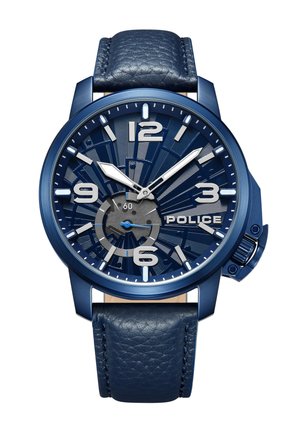 Montre analogique bleue avec un cadran texturé bleu, des index argentés et un bracelet en cuir bleu. Présente un design complexe et une couronne proéminente.