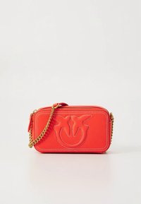 Red leather crossbody bag with a zigzag design and embossed logo. Features gold chain strap and zip closure. Textured finish and rectangular shape.