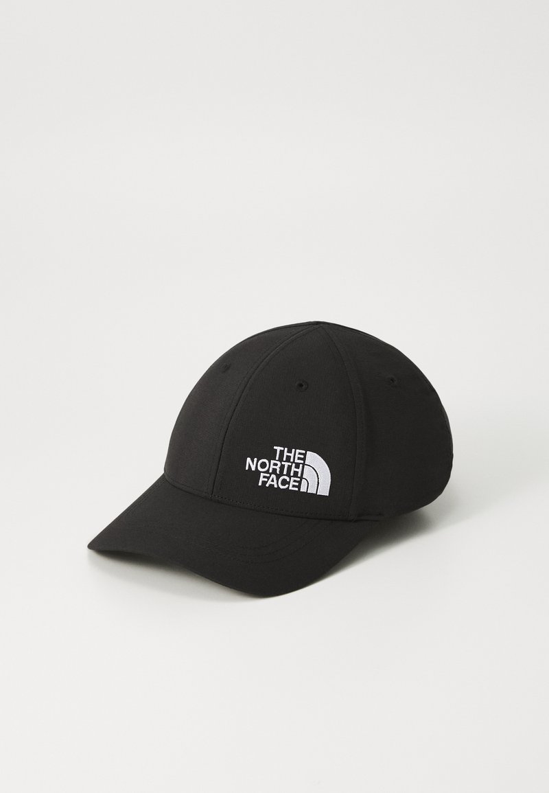 Fekete baseball sapka, amely szövetből készült, ívelt napellenzővel, hatszögletű dizájnnal és fehér hímzett "The North Face" logóval az elülső részén.