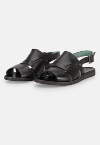 Sandali neri in pelle con punte aperte, cinturino alla caviglia regolabile e finitura liscia. Presentano design ritagliati e un interno imbottito di verde menta.