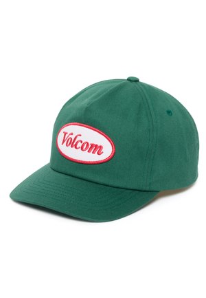 Vihreä kangaslakki, jossa on kaareva lippa ja etupaneelissa valkoinen soikea merkki, jossa lukee punaisella käsinkirjoitettuna "Volcom".