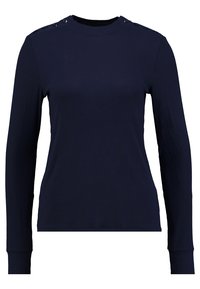 Maglietta a maniche lunghe blu navy realizzata in tessuto a coste, con dettagli in bottoni sulle spalle e scollo rotondo. Design semplice, aderente con orlo dritto.