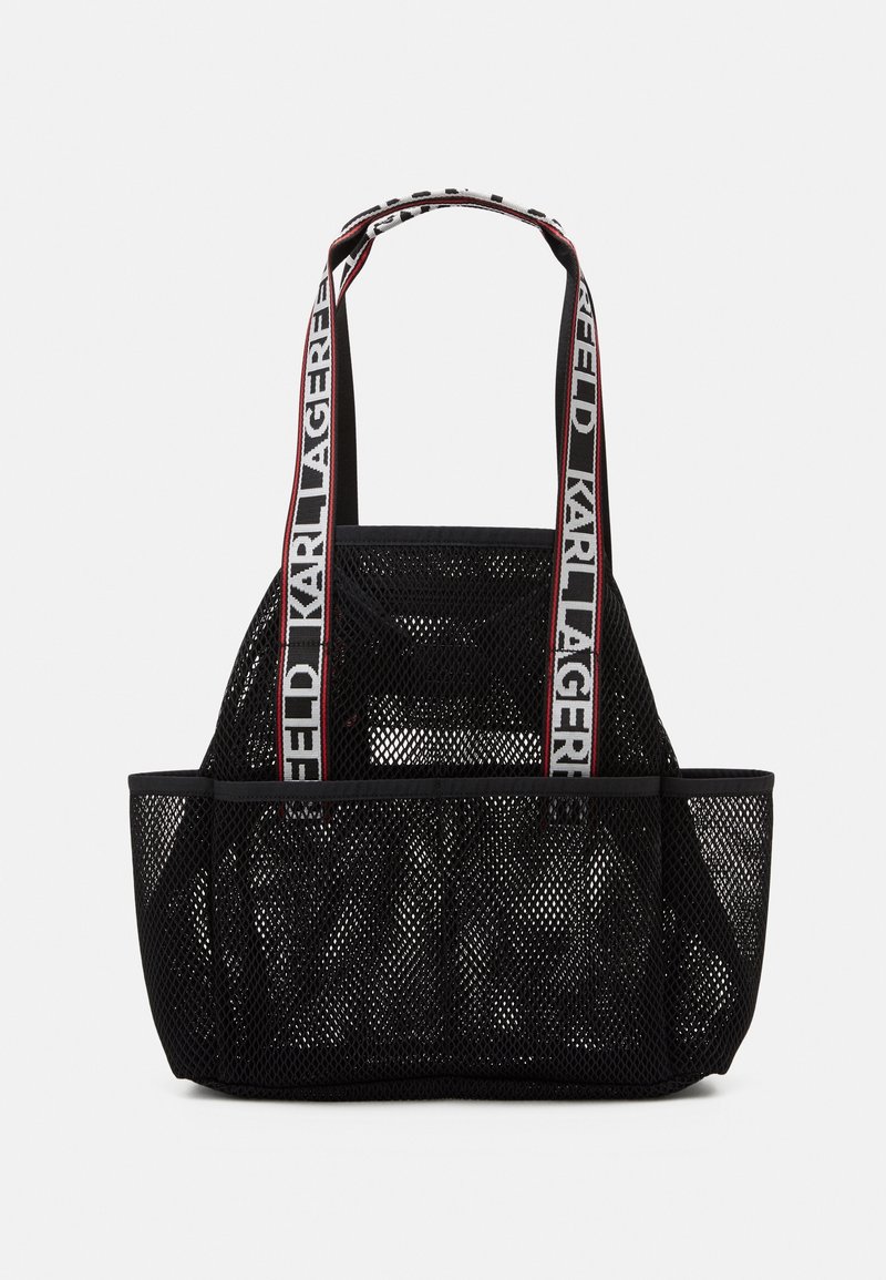 Sac cabas en mesh noir avec larges anses en tissu, texte "KARL LAGERFELD" en blanc avec bordure rouge.