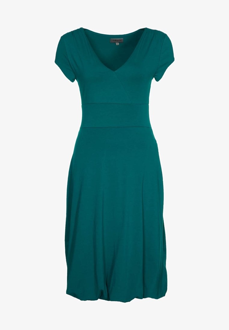 Teal mekko polven mittaan, joka on valmistettu pehmeästä materiaalista. Siinä on lyhyet hihat, V-pääntie ja istuva yläosa, joka laskeutuu levenevään hameeseen.