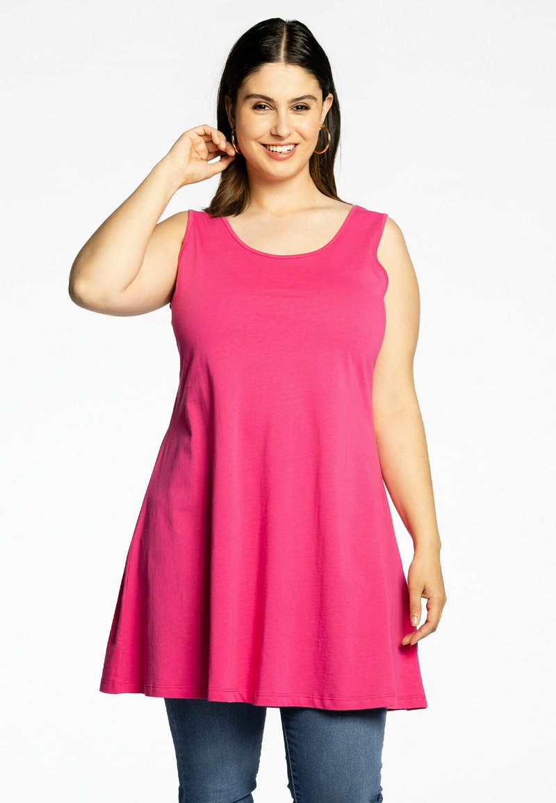 Roze mouwloze tuniek van zachte katoen, met een ronde halslijn en een ruime pasvorm die uitloopt vanaf de taille.