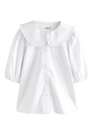 Blouse blanche à manches longues avec grand col arrondi à volants et boutons devant, avec manches froncées et poignets élastiques.