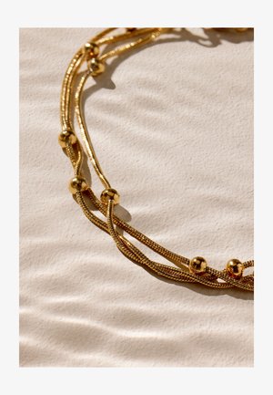 Next, Bracelet - gold tone