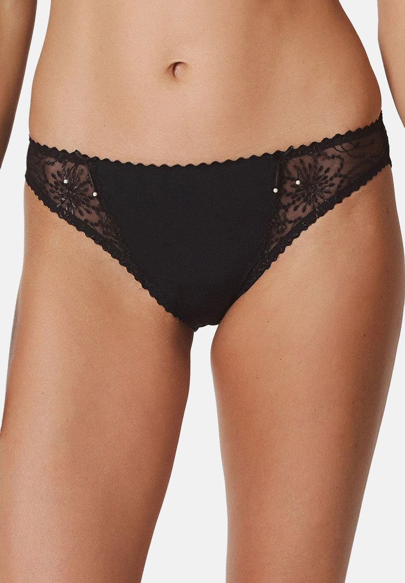 Black panties featuring a scalloped lace trim, floral lace accents on the sides, and small decorative beads. Smooth fabric base.