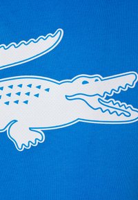 Lacoste Sport BIG LOGO - T-shirt desportiva - ibiza/white