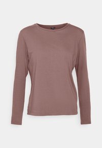 Långärmad skjorta i mauve, med rundad halsringning och en figurnära siluett. Tillverkad av mjukt, slätt tyg utan synliga mönster eller detaljer.