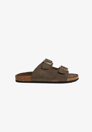 Sandales à glissière en daim marron avec deux brides à boucle réglables, semelle en liège et semelle extérieure en caoutchouc noir texturé.