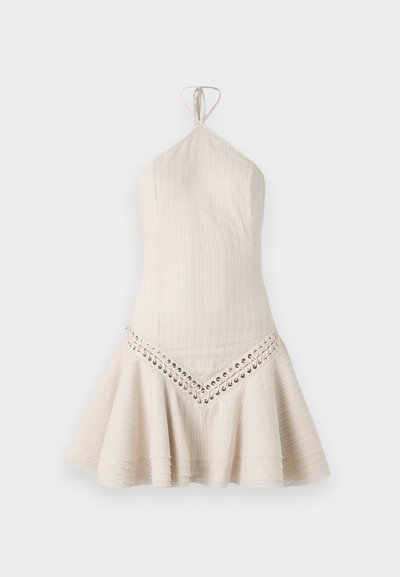 Kort halterneck kjole i lys beige stof med lodret ribbet tekstur og snørredetalje langs kanten. Flareet skørt design.