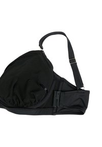 Reggiseno nero con tessuto testurizzato, coppe triangolari, spalline regolabili e chiusura con gancio e asola. Presenta dettagli arricciati sulle coppe.