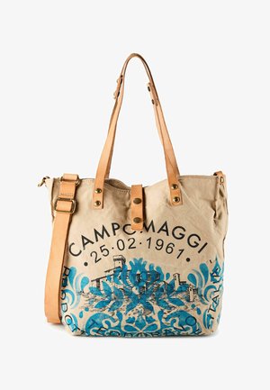 Canvas shopper met blauw bloemenpatroon, beige body en lederen bandjes. Voorzien van metalen knopen en een decoratieve logo-opdruk.