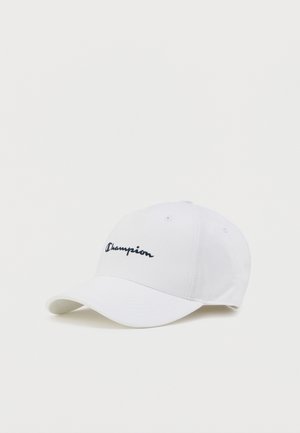 White baseball cap with a curved brim. Features a black embroidered "Champion" logo on the front. Made from textured fabric.
