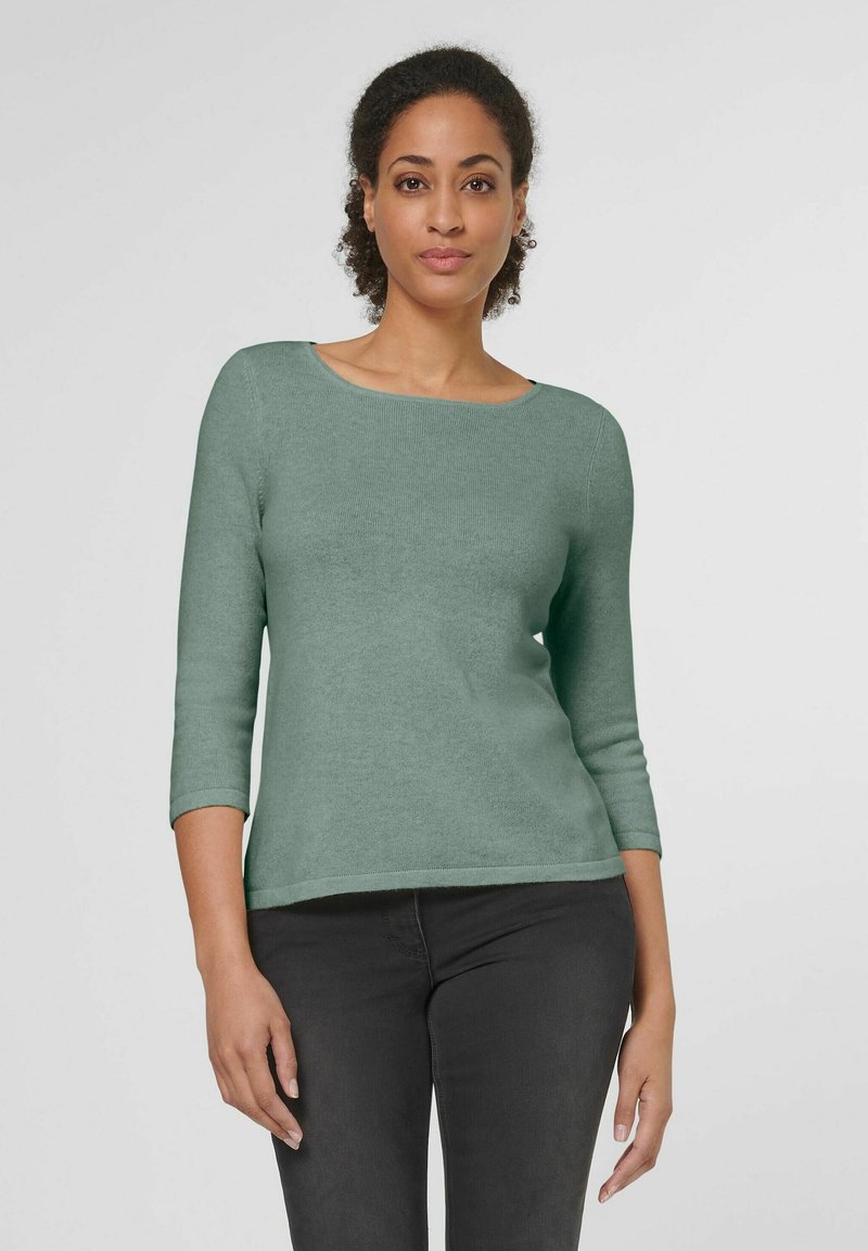 Mintgrüner, taillierter Pullover mit rundem Halsausschnitt und dreiviertellangen Ärmeln. Weiche Textur mit glattem Finish und subtilen Rippmuster.