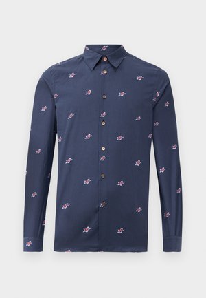 Navy blue shirt made of cotton with long sleeves, featuring small red and white star patterns and brown buttons. Classic collar design.