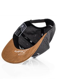 Gray cap with a brown, curved brim featuring visible stitching. Interior lined with black fabric, includes tags and small ventilation holes.