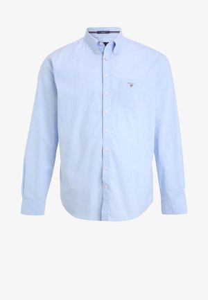 Jasnoniebieska koszula na guziki wykonana z bawełny, z kieszenią na piersi i klasycznym kołnierzem. Długie rękawy z mankietami na guziki, minimalistyczny design.