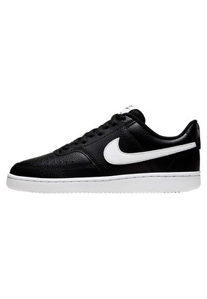 Black low-top sneaker with textured leather, white Nike swoosh logo on side, white sole, and black laces, shown in side profile.