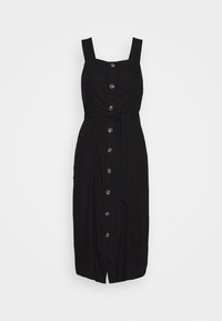 Svart klänning med justerbara axelremmar, knappslå framtill och ett knytbälte. Tillverkad av texturerad tyg, den faller strax nedanför knäet.