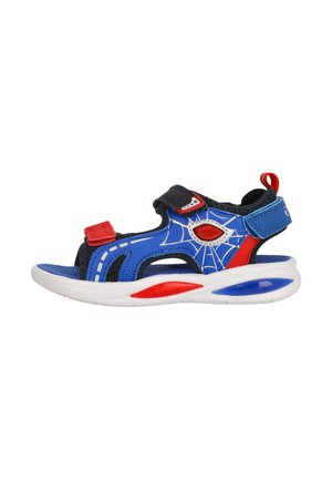 Blue and black sandal with red accents, featuring spider web pattern. Velcro strap, open design, and white sole with colored highlights.