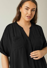 Evans OVERHEAD UTILITY - Tunica - black