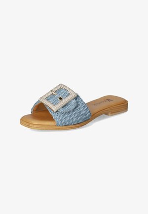 Blue woven slide sandal featuring a wide strap, a decorative silver buckle with rhinestones, and a flat beige sole.