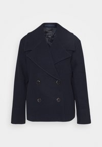 Manteau de marin en laine bleu marine avec un design croisé, grands revers et deux boutons à l'avant. Il présente une doublure lisse et des manches droites.