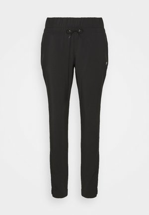 Black athletic pants made of soft material, featuring an elastic waistband with a drawstring, tapered leg design, and side pockets.