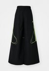 TEAMGEIST - Jogginghose - black/signal green