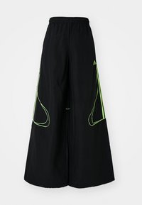 TEAMGEIST - Treniņtērpa apakšdaļas - black/signal green