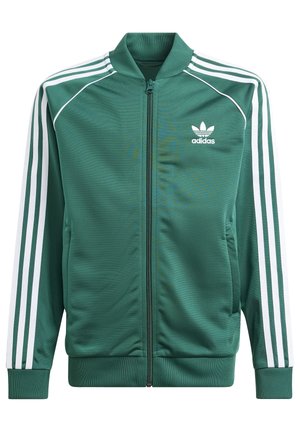 Zielona kurtka sportowa Adidas na zamek, z białymi trzema paskami na rękawach i logo Adidas trefoil na piersi.