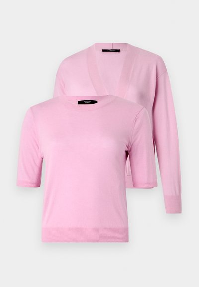 Two pink sweaters made of soft material; one has short sleeves and a crew neckline, while the other features long sleeves and a V-neck.
