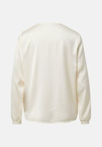 Langärmeliges cremefarbenes Hemd mit rundem Ausschnitt, schlichtem Design und weicher Textur. Verfügt über enganliegende Bündchen und einen geraden Saum.